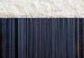 Uncooked rice and Platemat textures background Royalty Free Stock Photo