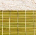 Uncooked rice and Platemat textures background Royalty Free Stock Photo