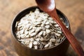 Uncooked rolled oats in wooden bowl Royalty Free Stock Photo
