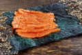 Uncooked salmon fish fillet on marble plate, top view ready to eat Royalty Free Stock Photo