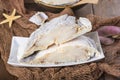 Uncooked salted cod on fishing nets Royalty Free Stock Photo