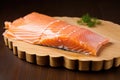 uncooked scalloped edge cedar plank holding salmon fillet Royalty Free Stock Photo