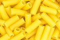 Uncooked short pasta tubes, elicoidali. Top view. Royalty Free Stock Photo