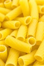 Uncooked short pasta tubes, elicoidali. Top view. Royalty Free Stock Photo