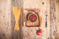 Uncooked spaghetti on wooden table . Topview of dried noodle