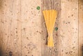 Uncooked spaghetti on wooden table . Topview of dried noodle