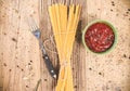 Uncooked spaghetti on wooden table . Topview of dried noodle