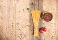 Uncooked spaghetti on wooden table . Topview of dried noodle