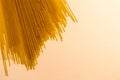 Uncooked Spaghettini Noodles Spread Out on White Royalty Free Stock Photo