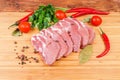 Uncooked steaks of pork neck on the wooden cutting board Royalty Free Stock Photo
