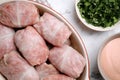 Uncooked stuffed cabbage rolls in baking dish on white marble table, flat lay Royalty Free Stock Photo