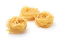 Uncooked tagliatelle pasta nests