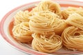 Uncooked tagliolini pasta nests Royalty Free Stock Photo
