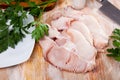 Uncooked tiger shark fillet fish with parsley and lemon on table