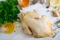 Uncooked turkey on the kitchen table with ingredients for marinade