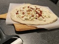 Uncooked white pizza with bacon Royalty Free Stock Photo