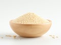 Uncooked white quinoa seeds, in the wooden bowl, isolated on pure white background, top view. Royalty Free Stock Photo