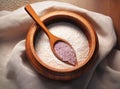 Uncooked white quinoa seeds, in the wooden bowl, isolated on pure white background, top view. Royalty Free Stock Photo