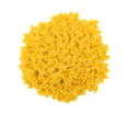 Uncooked yellow farfalle on a white isolated background. Typical Italian food pasta. Vegetarian dinner. Dry tasty macaroni.