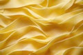 uncooked yellow fettuccine pasta arranged in a close-up view, showcasing its smooth texture and vibrant color
