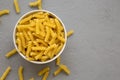 Uncooked Yellow Organic Rotini Pasta, top view. Flat lay, overhead, from above. Copy space Royalty Free Stock Photo