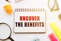 Uncover the benefits text written on office desk Royalty Free Stock Photo
