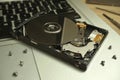 Uncovered broken 2.5 inch hard drive with unreadable data. Royalty Free Stock Photo