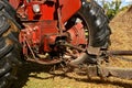 Uncovered shaft of a power takeoff of a tractor and a machine.