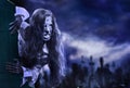 Undead zombie scary girl on halloween graveyard