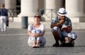 Undecided tourists couple looking at a guide book