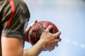 Undefined hands holding a ball prior to the Greek Women Cup Final handball game Arta vs Nea Ionia