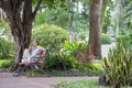 Ho Chi Minh City, Vietnam - September 1, 2018: an undefined man sitting at a corner of the park thinking about something.