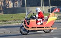 Undefined Santa delivering humanitarian aid in form of gifts to disabled children