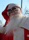 Undefined Santa delivering humanitarian aid in form of gifts to disabled children during