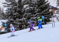 An undefined small skiers on the track of the competitionin