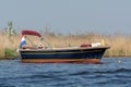 Undefined young couple women resting on boat floating on river