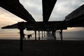 under an abandoned pier at sunset Royalty Free Stock Photo