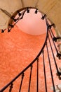 Under antique spiral staircase