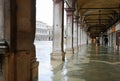 Under the arches in Saint Mark Square in Venice during flood Royalty Free Stock Photo