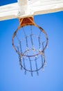 Orange basketball hoop with blue sky background Royalty Free Stock Photo
