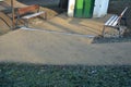 Under the bench are rectangles made of tiles. otherwise, the soft surface of the compacted gravel park path could erode the shoes