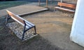 Under the bench are rectangles made of tiles. otherwise, the soft surface of the compacted gravel park path could erode the shoes