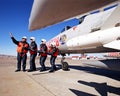 Under the blue sky, a military airport, four pilot beside the fighters eight aircraft flight simulation training