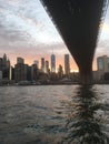 Under Brooklyn Brige on the East River looking at downtown Manhattan Royalty Free Stock Photo
