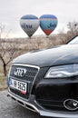 Under the Cappadocia balloons with the new model Audi A4 Allroad Royalty Free Stock Photo