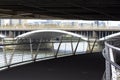 Under the Chelsea Bridge. View of the Thames and the railway bridge. Pedestrian bridge leading to Battersea Park Royalty Free Stock Photo