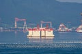 Under constructed off shore platform anchors in the bay in front of Samsung Heavy Industries or SHI in Geoje island Royalty Free Stock Photo