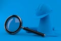 Under construction background with magnifying glass Royalty Free Stock Photo