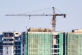 Under construction building with a crane on top and safety nets Royalty Free Stock Photo