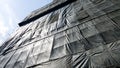 Under construction building that covered by black canvas Royalty Free Stock Photo